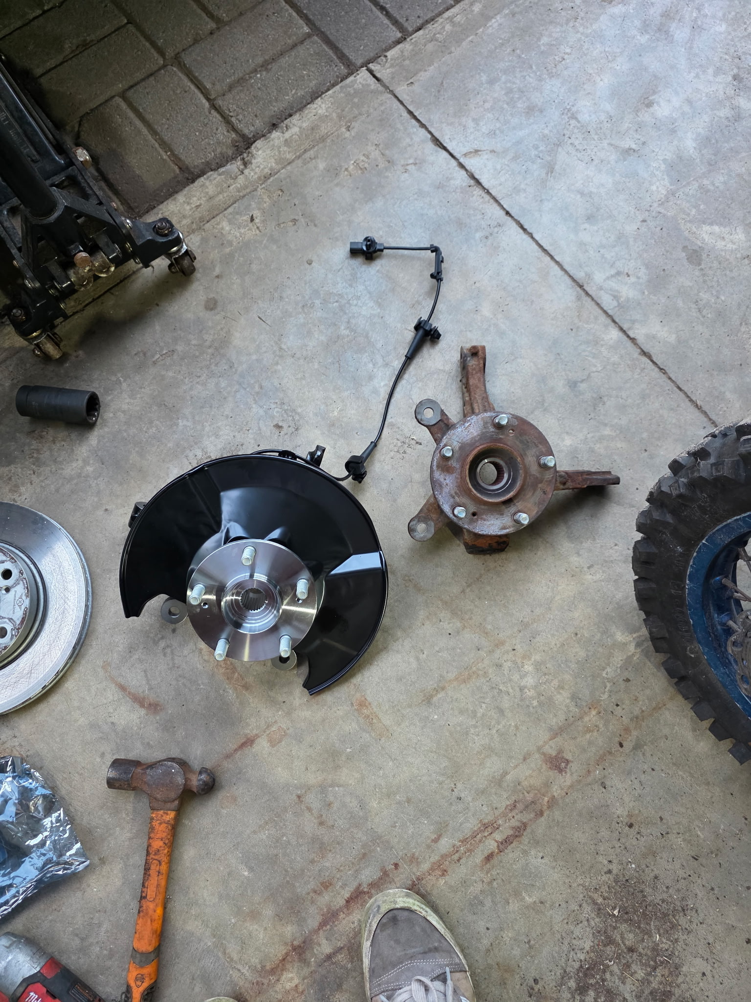 New hub assembly next to the old knuckle